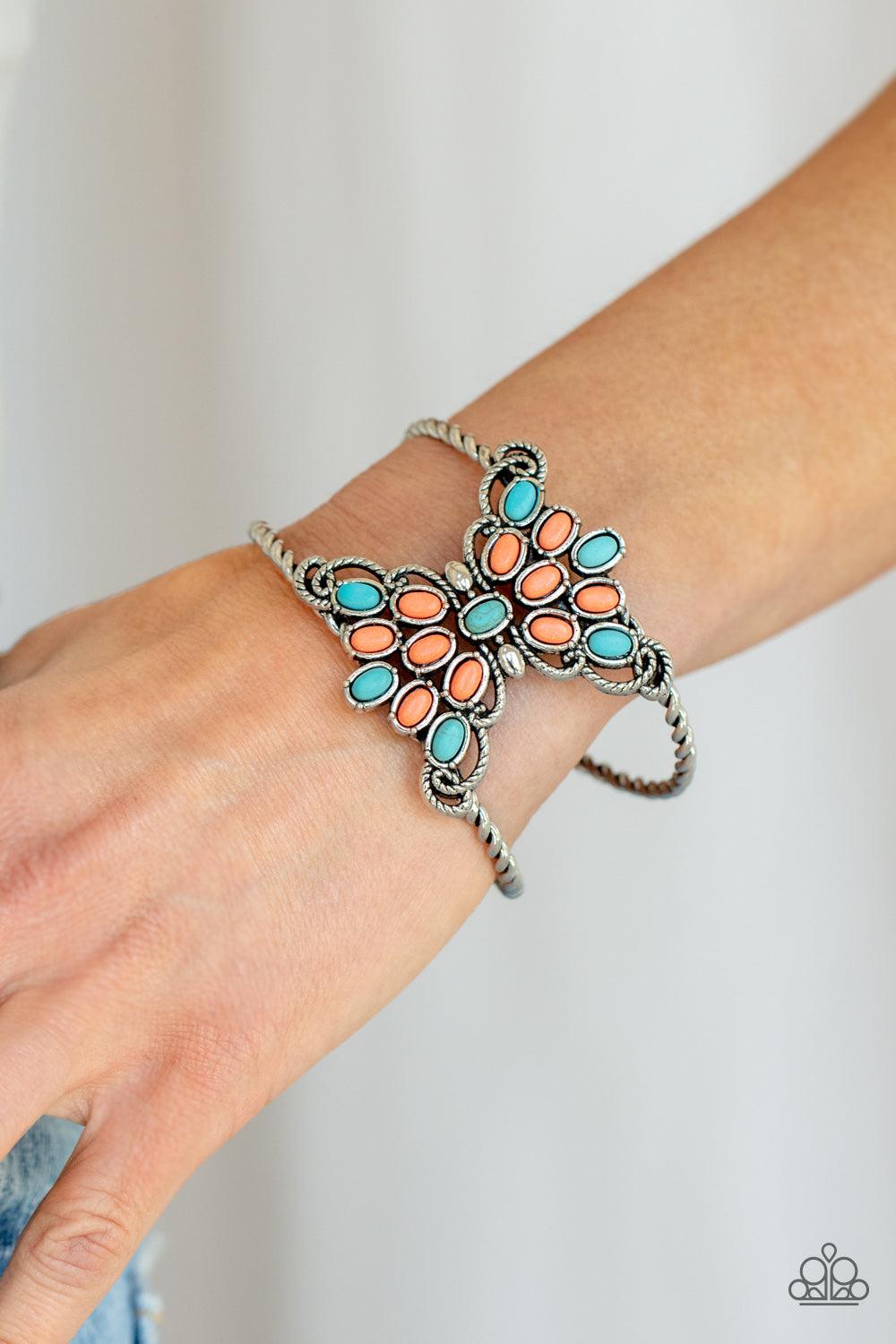 Paparazzi Accessories Pleasantly Plains - Multi Infused with studded silver fittings, a refreshing collection of turquoise and orange oval stones coalesce inside scalloped rows of silver ropelike filigree. The earthy stone centerpiece sits atop an airy si