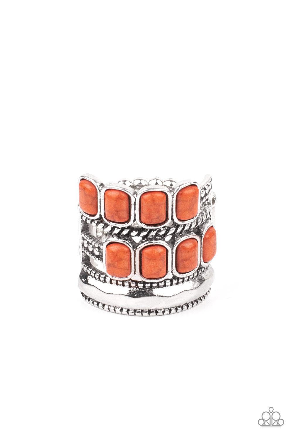 Paparazzi Accessories Mojave Monument - Orange Mismatched rows of Adobe rectangular stone beads, twisted silver and studded silver bars, and a faceted silver band haphazardly layer across the finger, coalescing into a colorfully rustic centerpiece. Featur