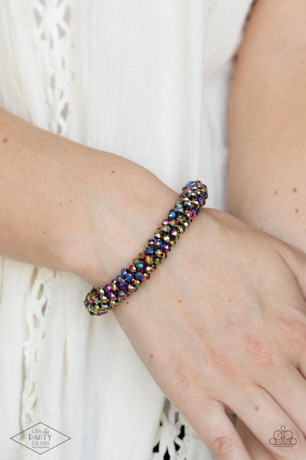 Paparazzi Accessories Wake Up and Sparkle - Multi Sparkling with dramatic brilliance, a collection of faceted dainty oil spill beads are threaded along a woven stretchy band creating a stunning statement around the wrist. Sold as one individual bracelet.