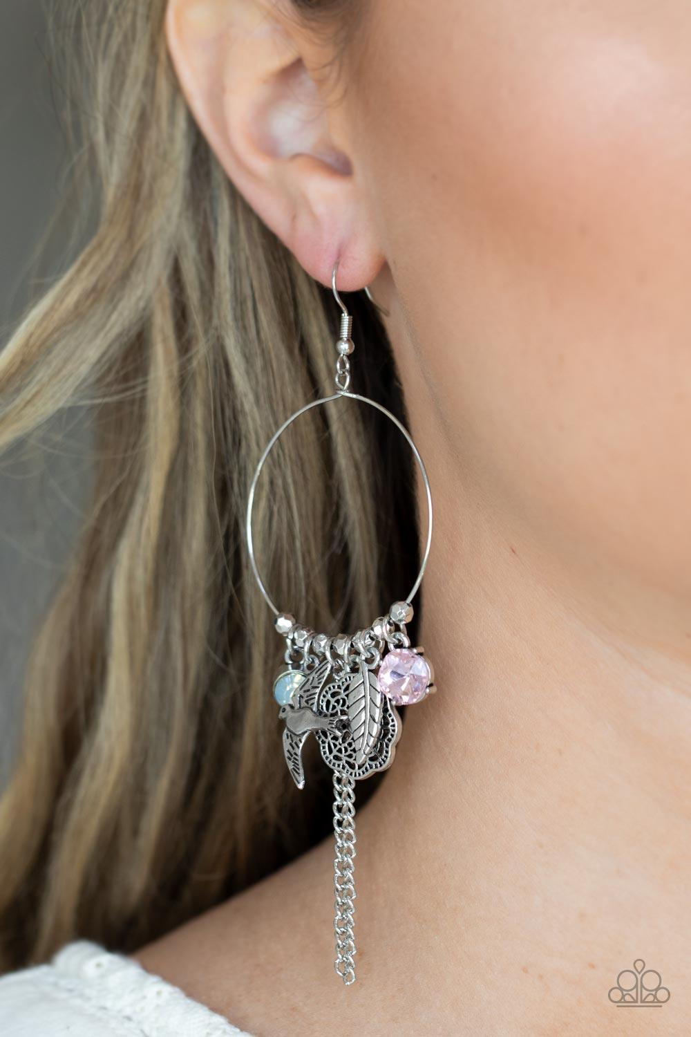 Paparazzi Accessories TWEET Dreams - Pink Free-spirited charms, including pink and iridescent gems, a floral medallion, a bird in flight, and a fluttering feather, dangle from a dainty silver ring coalescing into a charming lure. Earring attaches to a sta
