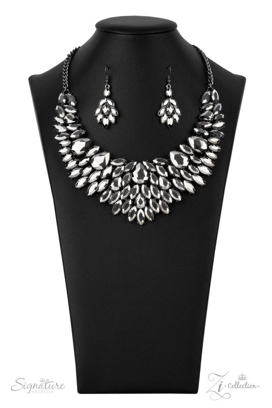 Paparazzi Accessories The Tanisha A smoldering collection of oversized teardrop and marquise cut hematite rhinestones daringly fan out from the collar, coalescing into intense interconnected frames. The dauntless display of dazzle locks in place, creating