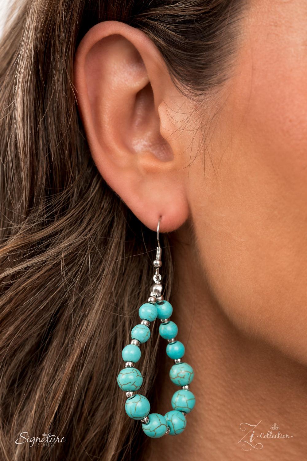 Paparazzi Accessories The Hilary Intermixed with dainty silver beads, a groundbreaking display of refreshing turquoise stone beads gradually increases in size as they drape into artisan inspired layers down the chest. The trailblazing length combined with