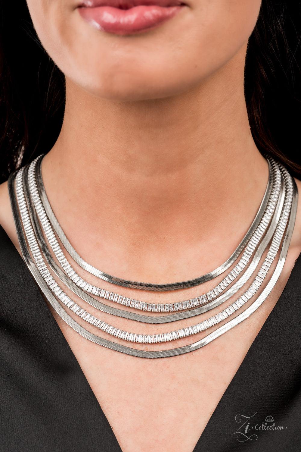 Paparazzi Accessories Persuasive Alternating rows of flat silver snake chain and glassy strands of edgy emerald cut rhinestones sleekly layer below the collar. The deceptively simple metallic silver and white rhinestone palette is unapologetically mesmeri