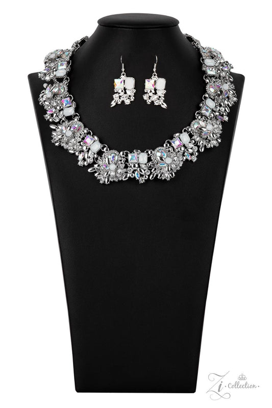 Paparazzi Accessories Exceptional An irresistible collection of iridescent, classic white, and milky white rhinestones intentionally coalesces and stacks into opulent silver accented frames. Varying in size and cuts, the mismatched rhinestone spangled fra