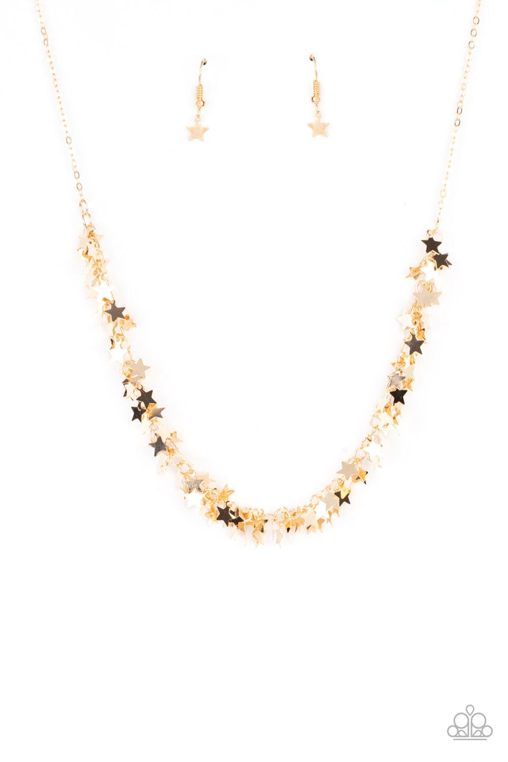 Paparazzi Accessories Starry Anthem - Gold A glistening collection of dainty gold star charms delicately cluster on a classic gold chain, creating a stellar fringe below the collar. Features an adjustable clasp closure. Sold as one individual necklace. In