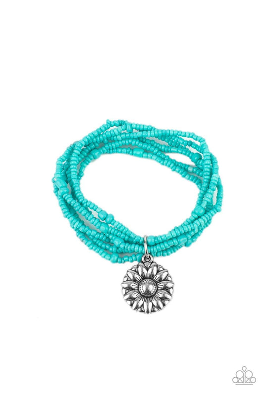 Paparazzi Accessories Badlands Botany - Blue An engraved silver sunflower charm dangles from layered strands of dainty seed beads in the vibrant hue of Tiffany Blue. The mismatched beads are threaded along stretchy bands for a vibrant splash of color arou