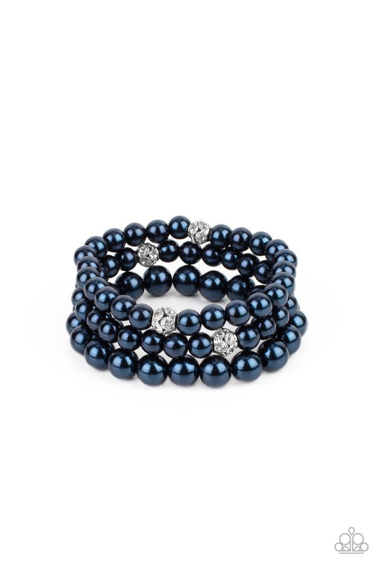 Paparazzi Accessories Here Comes The Heiress - Blue Infused with white rhinestone encrusted silver beads, a bubbly collection of mismatched blue pearls are threaded along stretchy bands around the wrist for a vintage inspired layered look. Sold as one set