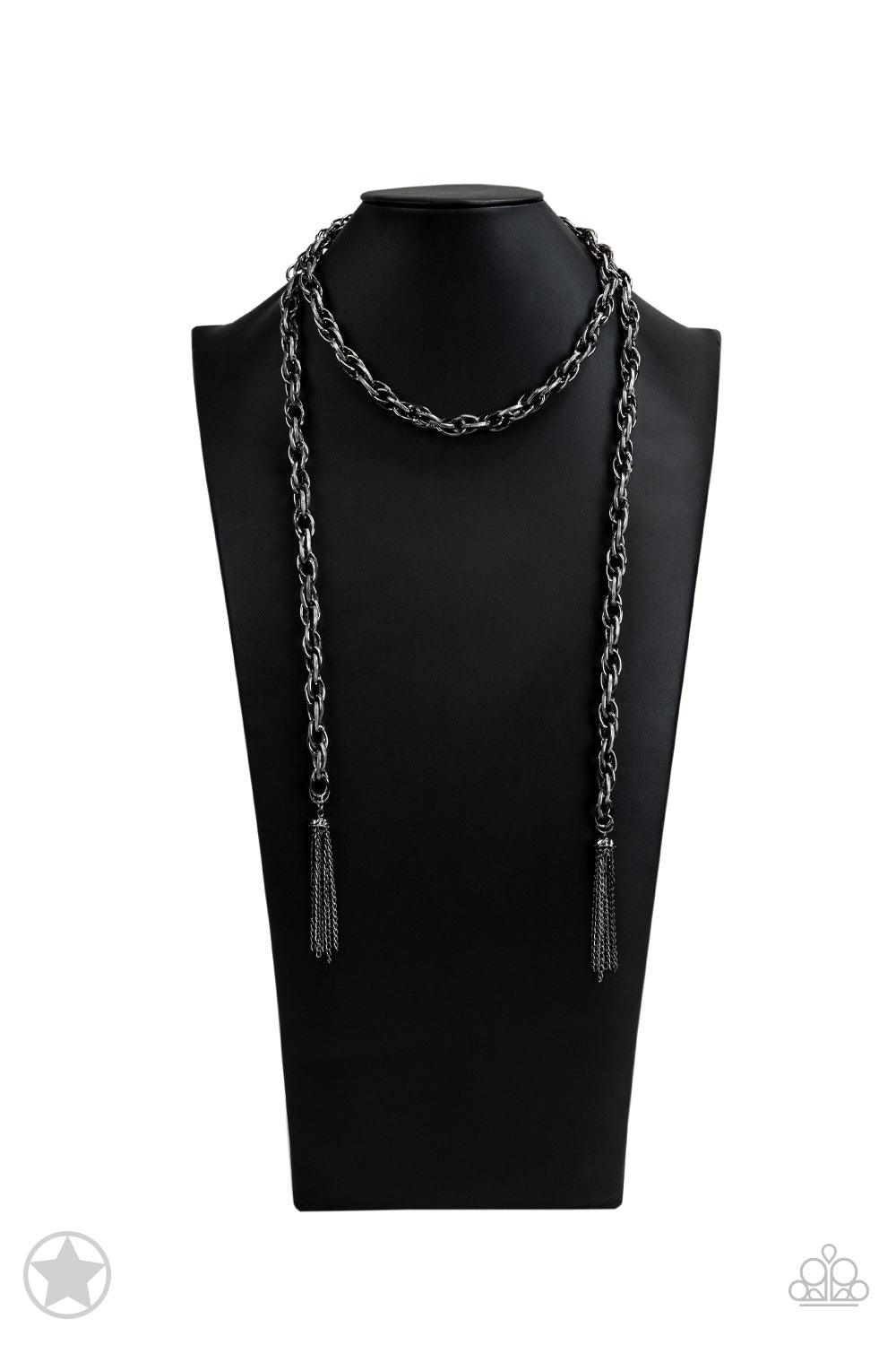 Paparazzi Accessories SCARFed for Attention - Gunmetal A single strand of spiraling, interlocking links with light-catching texture is anchored by two tassels of chain that add dramatic length to the piece. Undeniably the most versatile piece in Paparazzi