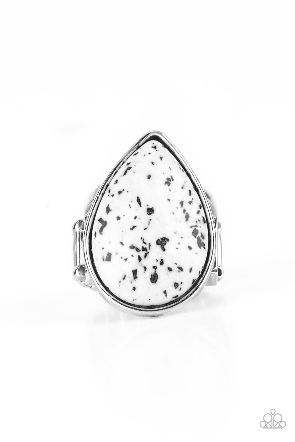 Paparazzi Accessories Stormy Sunrise - White A generous polished white stone infused with black flecks is encased in a simple silver teardrop frame resulting in a seasonal finish atop the finger. Features a stretchy band for a flexible fit. Sold as one in