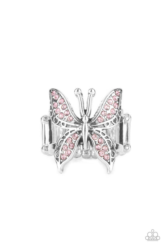 Paparazzi Accessories Blinged Out Butterfly - Pink Glittery sections of pink rhinestones delicately encrust the decorative wings of a silver butterfly, creating a whimsically fluttering centerpiece atop the finger. Features a stretchy band for a flexible