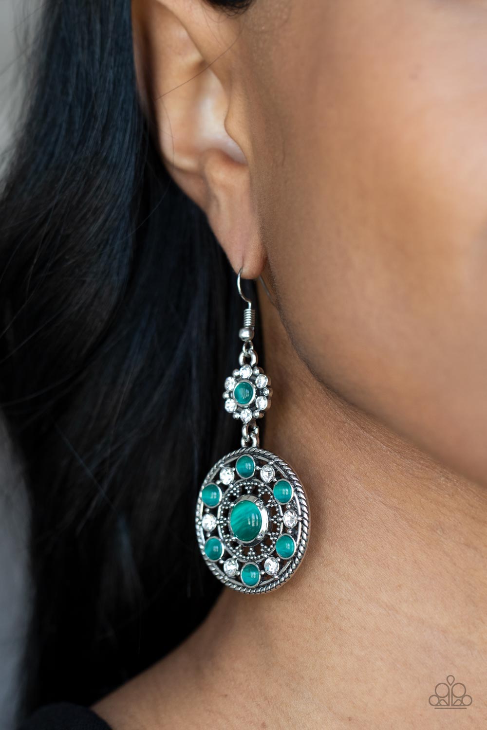 Paparazzi Accessories Party at My PALACE - Green A bubbly collection of Leprechaun cat's eye stones and glassy white rhinestones embellish the front of a studded silver frame. The circular frame swings from the bottom of a matching floral fitting, creatin