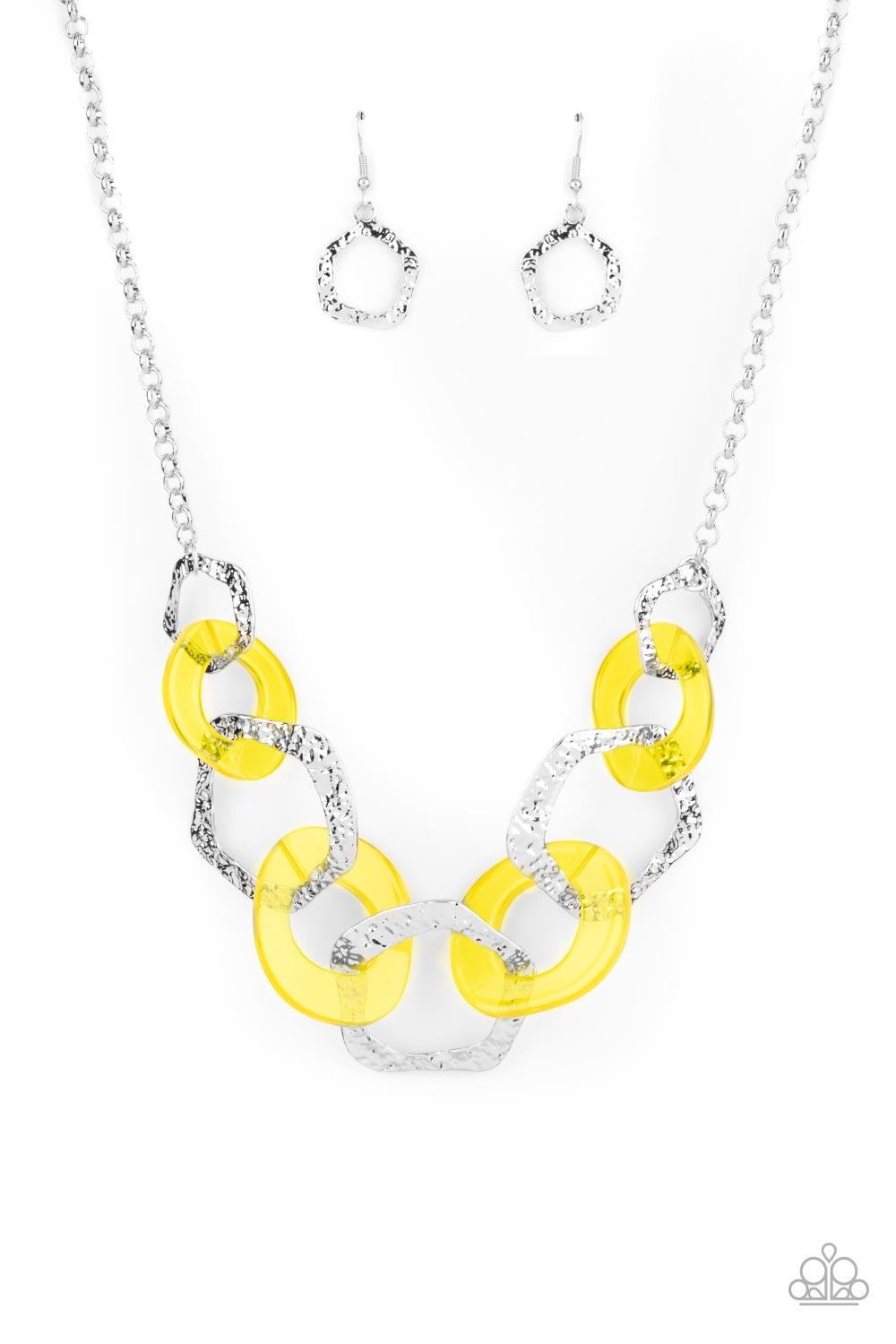 Paparazzi Accessories Urban Circus - Yellow An asymmetrical assortment of Illuminating acrylic rings and hammered silver hoops boldly interlock below the collar, creating an intense pop of color. Features an adjustable clasp closure. Sold as one individua