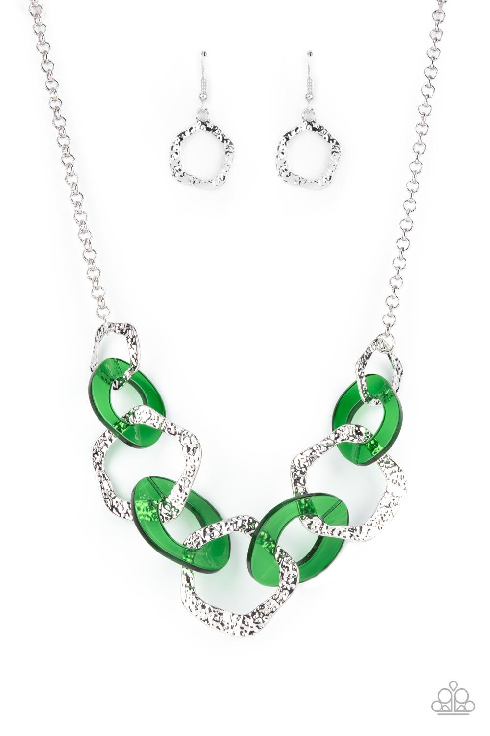 Paparazzi Accessories Urban Circus - Green An asymmetrical assortment of Leprechaun acrylic rings and hammered silver hoops boldly interlock below the collar, creating an intense pop of color. Features an adjustable clasp closure. Sold as one individual n