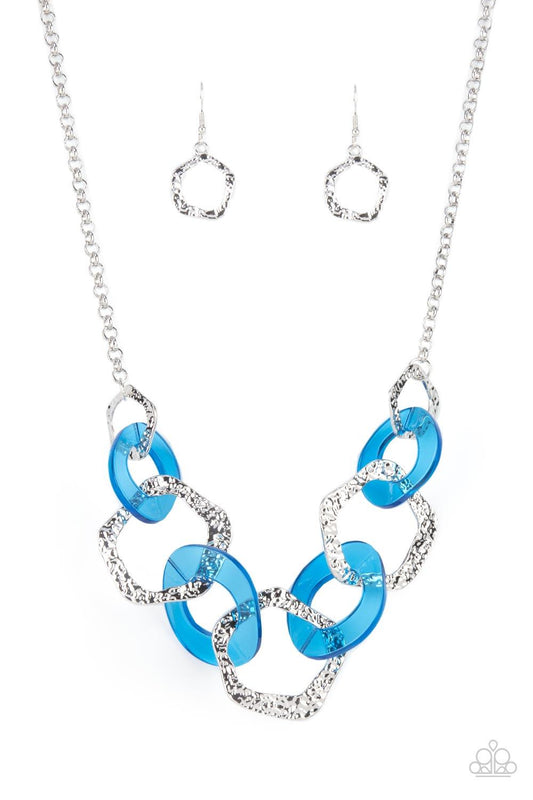 Paparazzi Accessories Urban Circus - Blue An asymmetrical assortment of neon blue acrylic rings and hammered silver hoops boldly interlock below the collar, creating an intense pop of color. Features an adjustable clasp closure. Sold as one individual nec