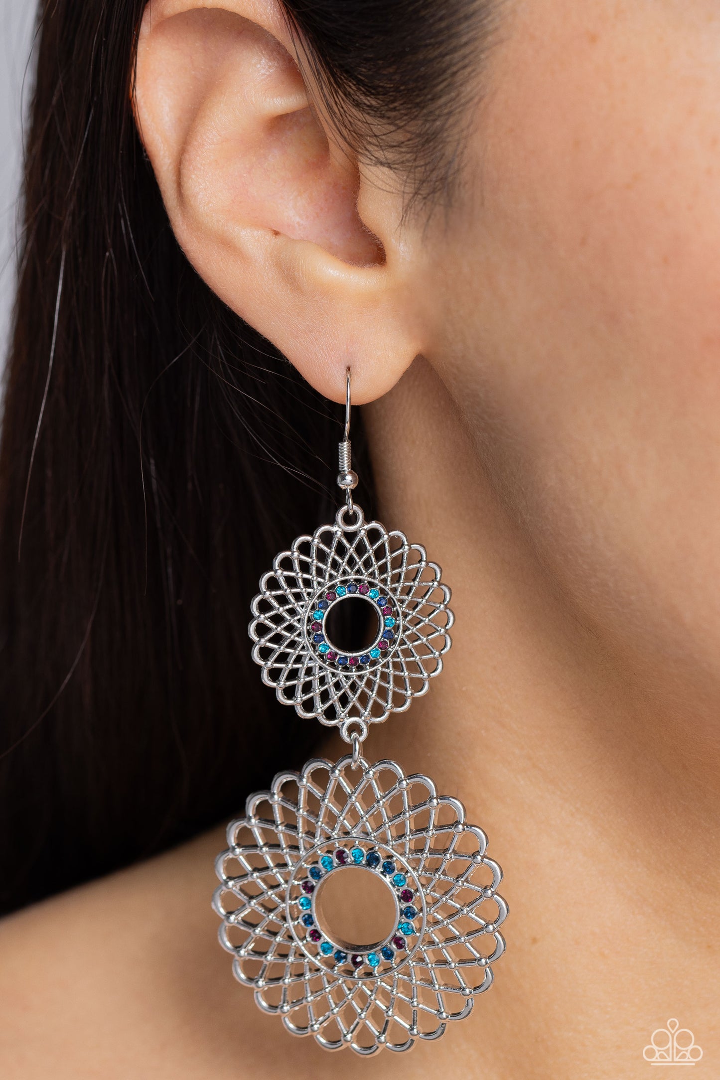 Paparazzi Accessories Regal Roulette - Mutli Airy silver petals infinitely overlap into two dizzying silver floral medallions. Rings of dainty multicolored rhinestones adorn the center, adding a dash of dazzle. Earring attaches to a standard fishhook fitt