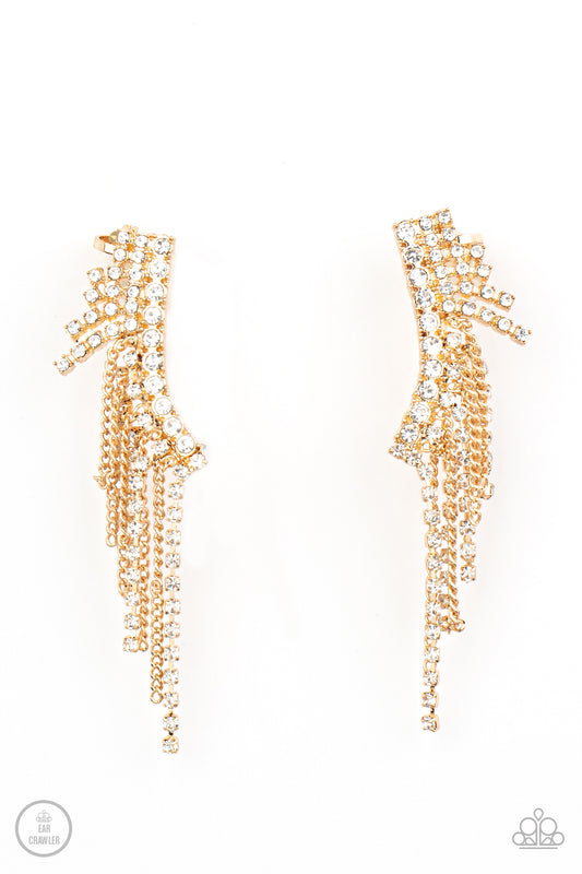 Paparazzi Accessories Thunderstruck Sparkle - Gold A tapered fringe of dainty gold chains and glittery strands of white rhinestones cascades from the edge of a curving white rhinestone encrusted frame, creating an edgy centerpiece. Features a clip-on fitt