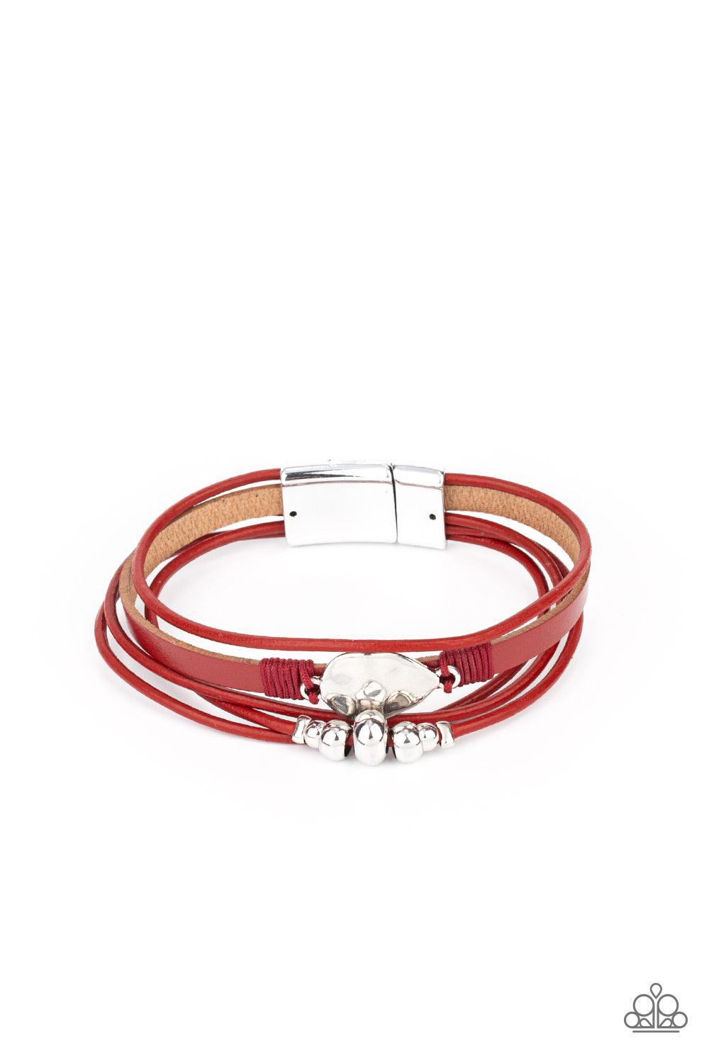 Paparazzi Accessories Tahoe Tourist - Red Infused with a silver beaded accent, rows of shiny red cording join a red leather band around the wrist. A hammered silver teardrop is knotted in place with red thread, adding an artisanal touch to the colorfully