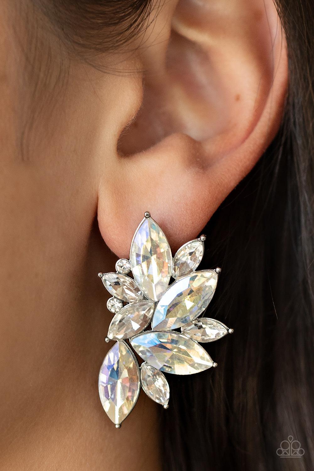 Paparazzi Accessories Instant Iridescence - White Infused with dainty white rhinestones, a stellar display of iridescent and white marquise cut rhinestones fan out into a spectacular centerpiece. Earring attaches to a standard post fitting. Sold as one pa