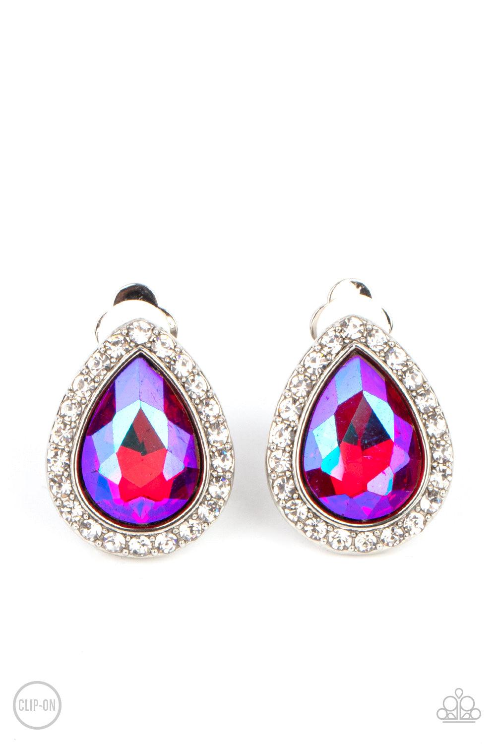 Paparazzi Accessories Cosmic Castles - Pink *Clip-On Featuring a flashy UV finish, a faceted pink teardrop gem is pressed into a silver frame bordered with glittery white rhinestones for a glamorous finish. Earring attaches to a standard clip-on fitting.