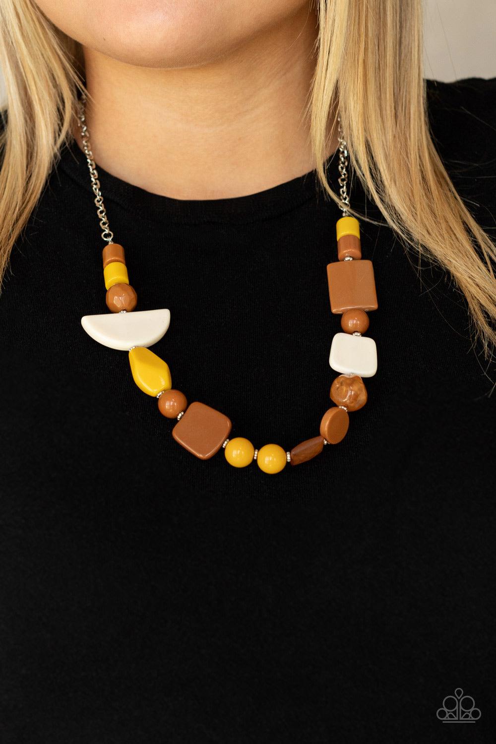 Paparazzi Accessories Tranquil Trendsetter - Yellow Featuring the rustic hues of Adobe, Mustard, and Soybean, mismatched acrylic and faux rock beads are haphazardly threaded along an invisible wire below the collar for an abstract artisan vibe. Features a