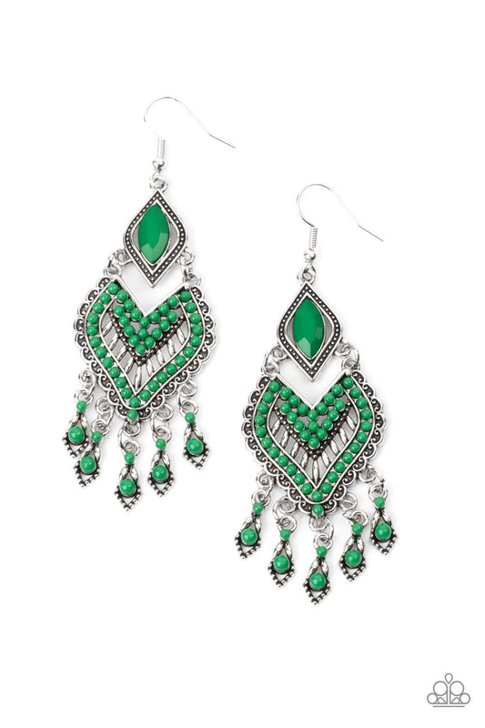 Paparazzi Accessories Dearly Debonair - Green Featuring the refreshing green hue of Leprechaun, dainty seed beads adorn the front of a scalloped heart shaped frame that swings from the bottom of a studded silver frame adorned in a marquise cut Leprechaun