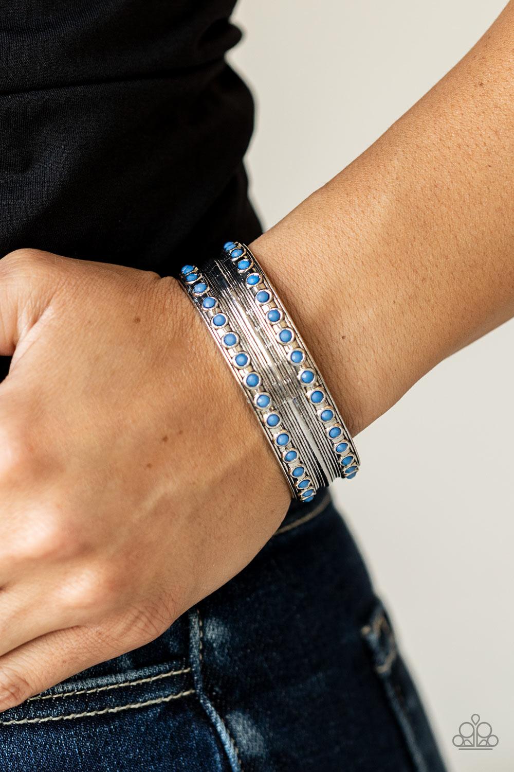 Paparazzi Accessories Costa Rica Retreat - Blue Etched and embossed in stacks of linear texture, an antiqued silver cuff is bordered in rows of faceted Spring Lake beads for a refreshing finish. Sold as one individual bracelet. Bracelets