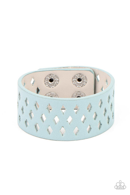 Paparazzi Accessories Glamp Champ - Blue A wide blue leather band is filled with patterned rows of small diamond-shaped cutouts giving the illusion of diamonds floating across the wrist in a whimsical fashion. Features an adjustable snap closure. Sold as
