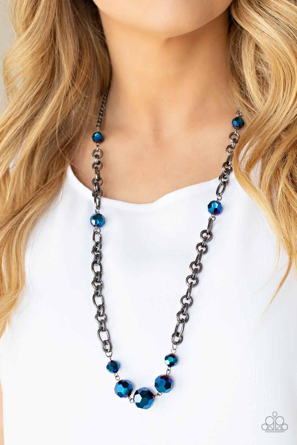Paparazzi Accessories Prismatic Pick-Me-Up - Multi Featuring an oil spill iridescence, faceted metallic blue beads adorn sections of chunky gunmetal chains across the chest for a gritty glamorous fashion. Features an adjustable clasp closure. Sold as one
