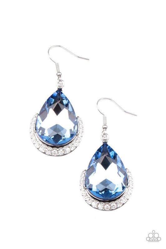 Paparazzi Accessories Mega Marvelous - Blue Dotted in white rhinestones, a dainty silver bar curves around the bottom of a dramatically oversized blue teardrop rhinestone for a glamorous fashion. Earring attaches to a standard fishhook fitting. Sold as on
