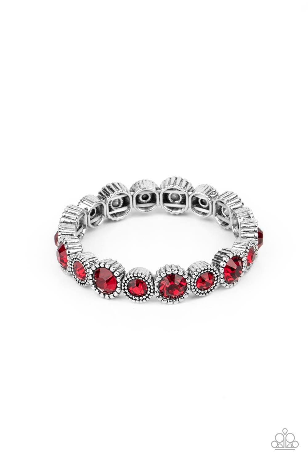 Paparazzi Accessories Phenomenally Perennial - Red Featuring mismatched silver studded fittings, an oversized collection of sparkly red rhinestones are threaded along a stretchy band around the wrist for a fiery pop of color. Sold as one individual bracel