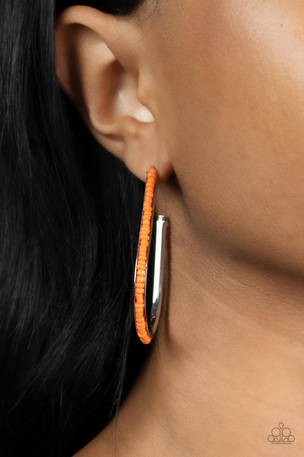 Paparazzi Accessories Beaded Bauble - Orange A dainty collection of orange seed beads embellish the beveled spine of a silver hook shaped hoop, creating a trendy pop of color. Hoop measures approximately 1 1/2" in diameter. Earring attaches to a standard