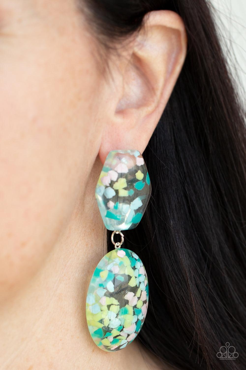 Paparazzi Accessories Flaky Fashion - Multi Featuring multicolored confetti-like flakes, a clear acrylic oval frame swings from the bottom of a matching hexagonal frame, creating a bubbly lure. Earring attaches to a standard post fitting. Sold as one pair
