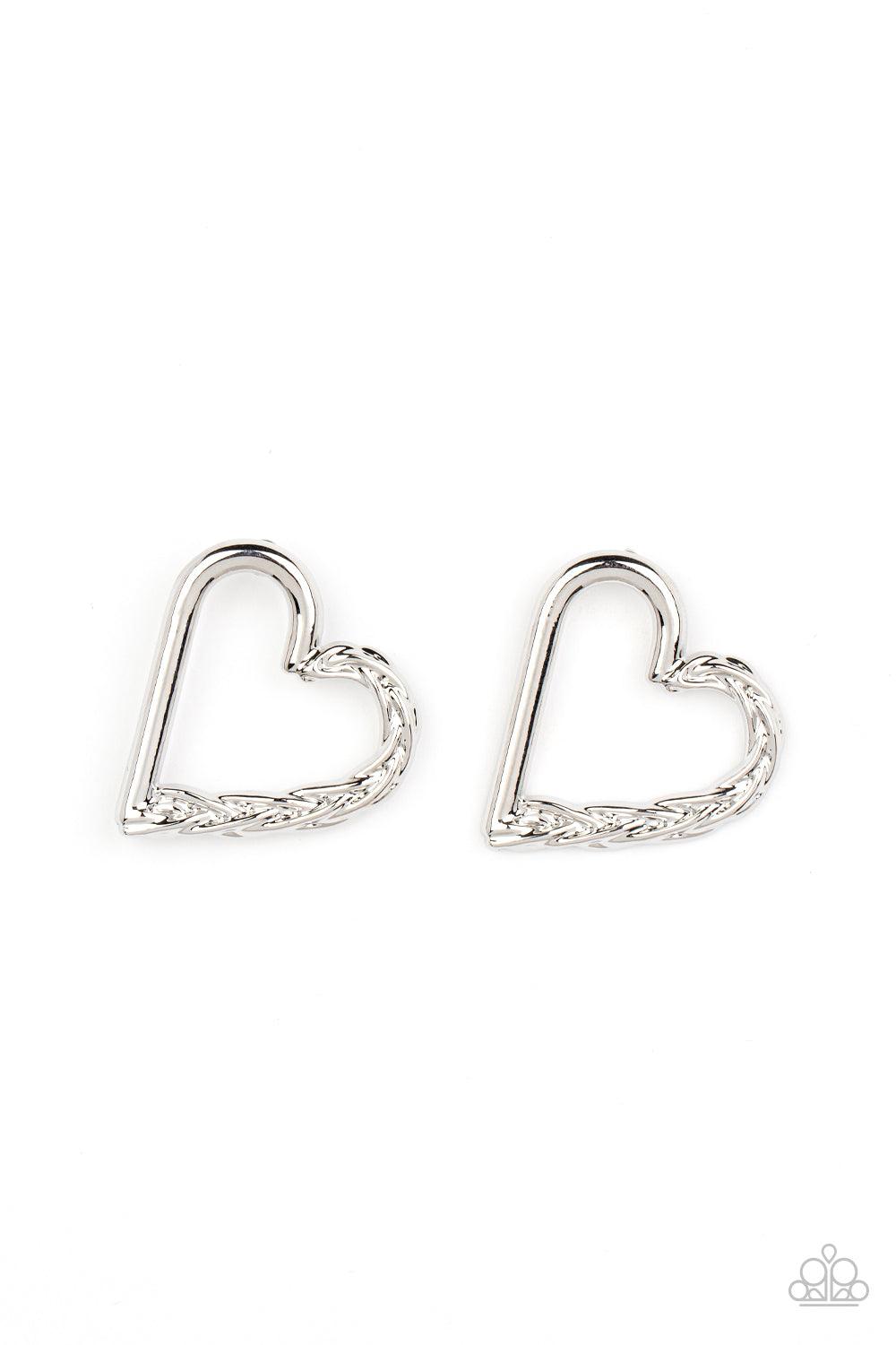 Paparazzi Accessories Cupid, Who? - Silver One side of a glistening silver heart frame is subtlety twisted with twinkly texture, creating a romantic display. Earring attaches to a standard post fitting. Sold as one pair of post earrings. Jewelry