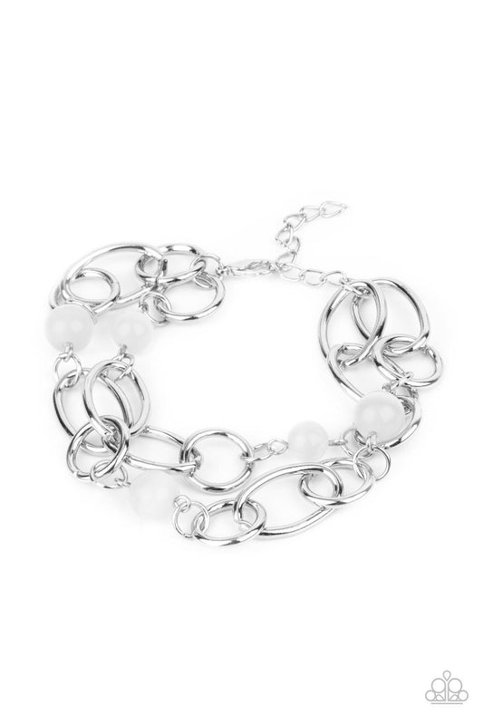 Paparazzi Accessories Delightfully Daydreamy - White Chunky silver links and glassy white cat's eye stone beads join into two dreamy layers around the wrist, creating a whimsical centerpiece. Features an adjustable clasp closure. Sold as one individual br