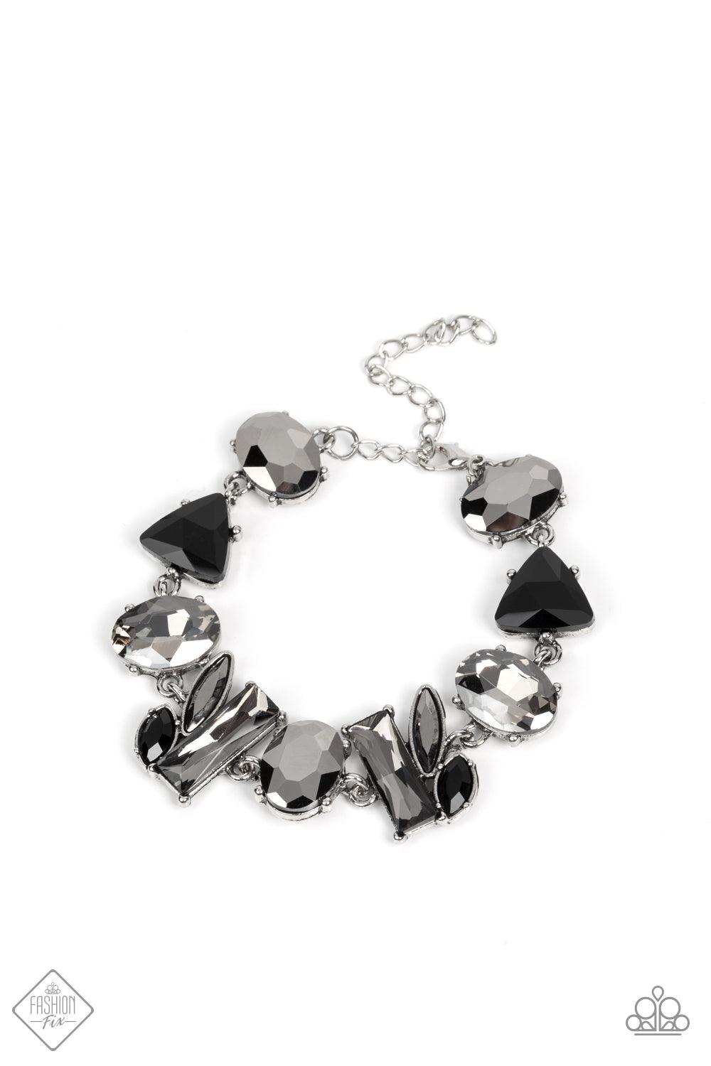 Paparazzi Accessories Marvelously Modish - Silver Featuring edgy pronged settings and antiqued silver frames, a mismatched collection of lustrous hematite, smoky, and black rhinestones in various shapes and sizes unite into a gritty modern mashup around t