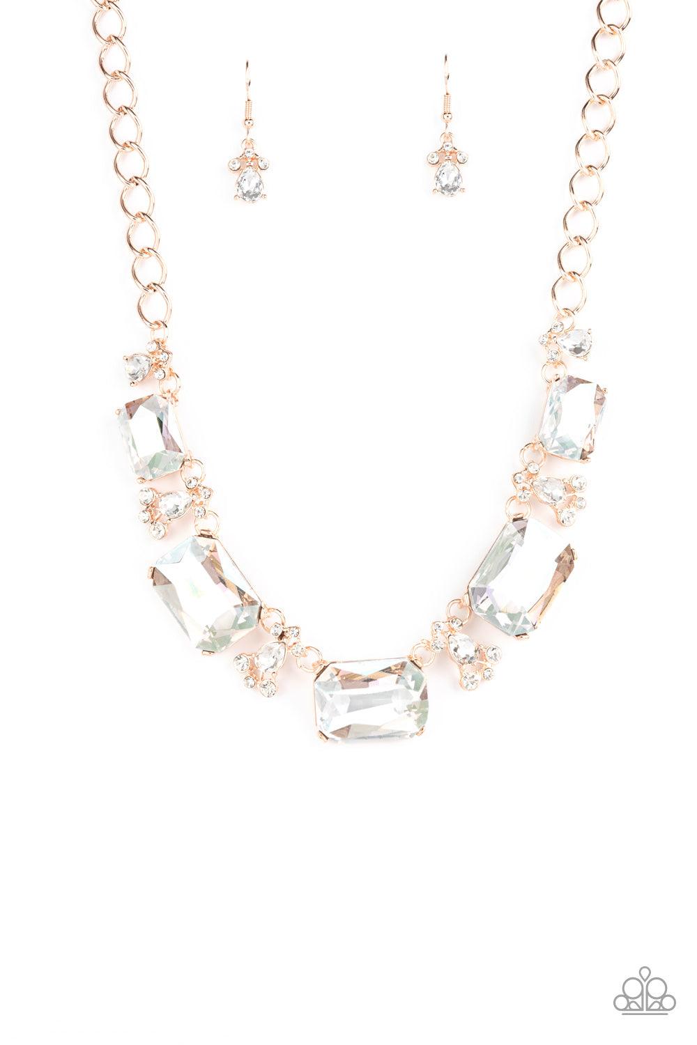 Paparazzi Accessories Flawlessly Famous - Multi Encased in sleek rose gold fittings, an oversized collection of emerald cut white rhinestones link with rhinestone dotted teardrop rhinestone frames below the collar for a jaw-dropping display. Features an a