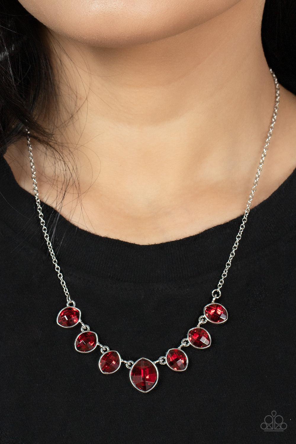 Paparazzi Accessories Material Girl Glamour - Red Encased in sleek silver fittings, elegant cut fiery red rhinestones delicately connect below the collar. An oversized red rhinestone adorns to the middle of the glittery strand, creating a sparkly centerpi