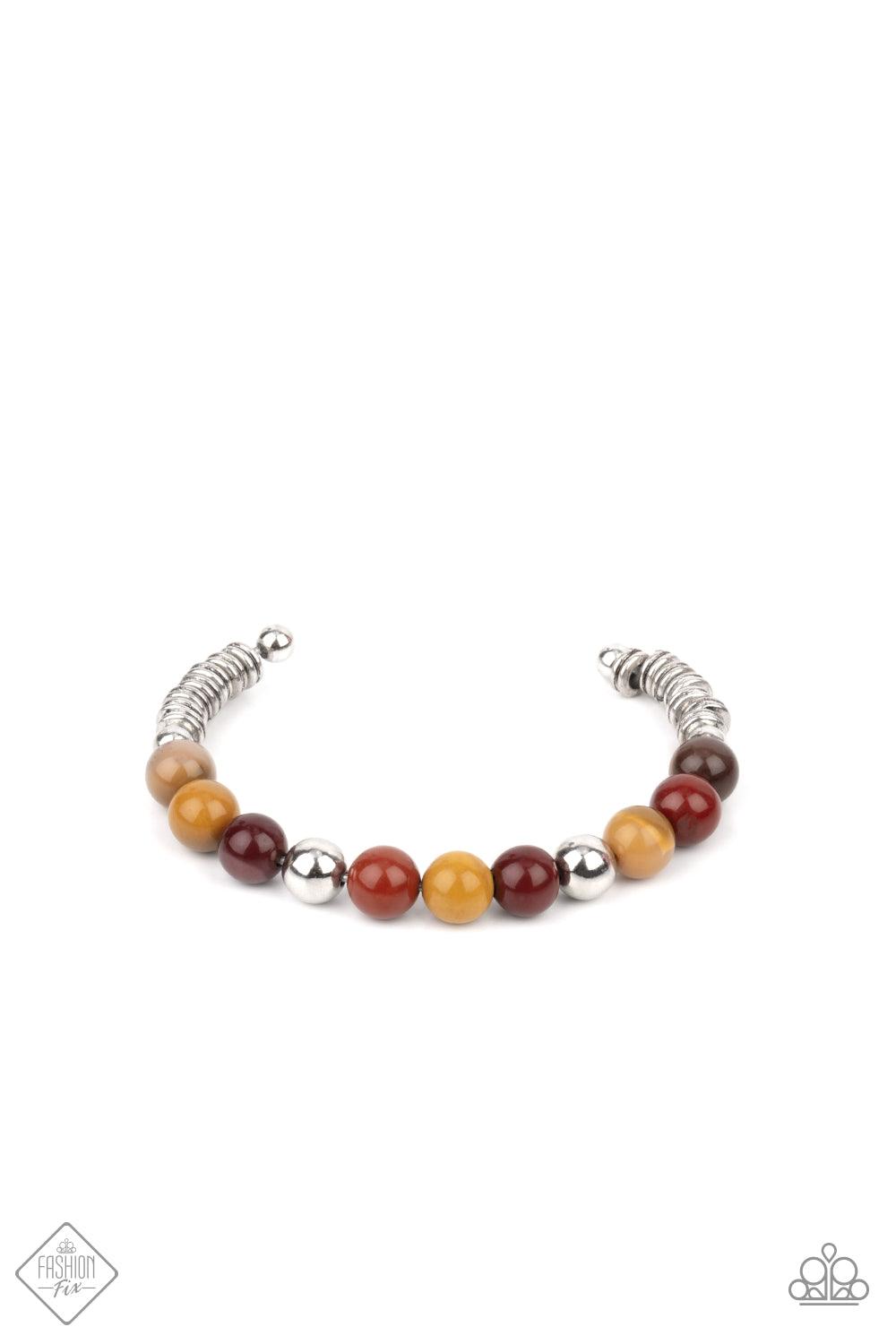 Paparazzi Accessories Pure Prana - Multi Accented with shiny silver beads, a collection of polished multicolored stone beads are fashioned into a wire cuff bracelet. The earthy stones give way on each end to a number of silver rings enclosed by small silv