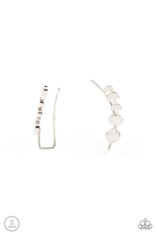 Paparazzi Accessories Its Just a Phase - Silver A dainty silver bar displays the phases of the moon as it curls across the ear for a stellar look. Features an extended post fitting that climbs the back of the ear and can be pressed together for a more sec