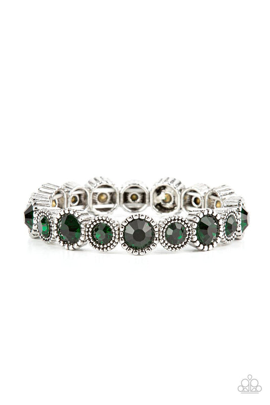 Paparazzi Accessories Phenomenally Perennial - Green Sparkling green gems are encased in studded silver frames. Varying in size, smaller gems alternate with larger gems along stretchy bands around the wrist for a dramatic look. Sold as one individual brac