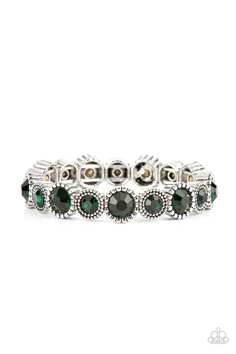 Paparazzi Accessories Phenomenally Perennial - Green Sparkling green gems are encased in studded silver frames. Varying in size, smaller gems alternate with larger gems along stretchy bands around the wrist for a dramatic look. Sold as one individual brac