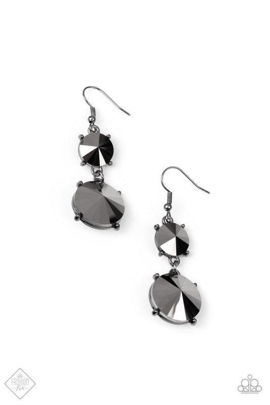 Paparazzi Accessories Sizzling Showcase - Black Featuring pronged gunmetal fittings, two oversized hematite rhinestones dramatically link into a bold smoldering lure as they drip dazzlingly from the ear. Earring attaches to a standard fishhook fitting. So