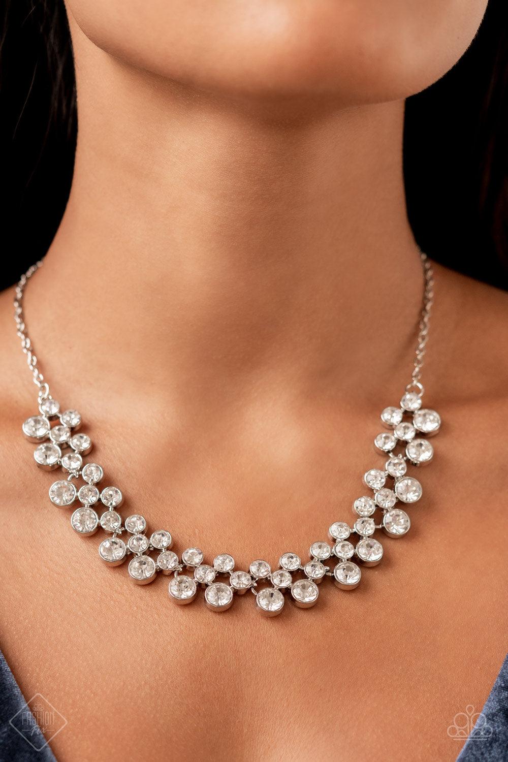 Paparazzi Accessories Won The Lottery - White Layers of brilliant white rhinestones in graduating sizes are encased in simple silver frames as they fall from a classic silver chain and delicately link across the collar, creating a dramatic display of swoo