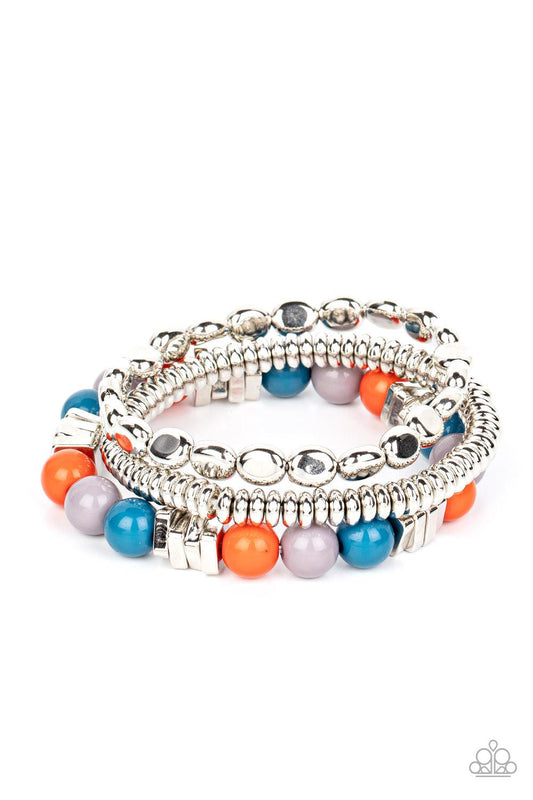 Paparazzi Accessories Tour de Tourist - Multi A mismatched collection of silver discs, silver cubes, bubbly multicolored acrylic, and silver pebble-like beads are threaded along stretchy bands around the wrist, creating fiery layers. Sold as one set of th