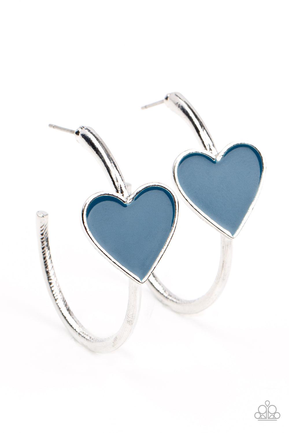 Paparazzi Accessories Kiss Up - Blue A charming Mykonos Blue heart adorns the front of a classic silver hoop resulting in a whimsical fashion. Earring attaches to a standard post fitting. Hoop measures approximately 1 1/4" in diameter. Sold as one pair of