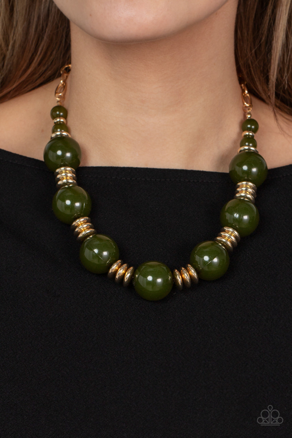 Paparazzi Accessories Race to the POP - Green An oversized collection of glassy Olive Branch beads and shiny gold discs are threaded along an invisible wire, creating a dramatic pop of color below the collar. Features an adjustable clasp closure. Sold as