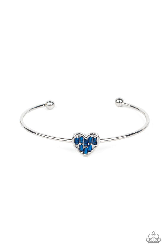 Paparazzi Accessories Heart of Ice - Blue A studded silver heart is encrusted in emerald cut blue rhinestones, creating a flirtatious centerpiece atop a dainty silver cuff. Sold as one individual bracelet. Bracelets