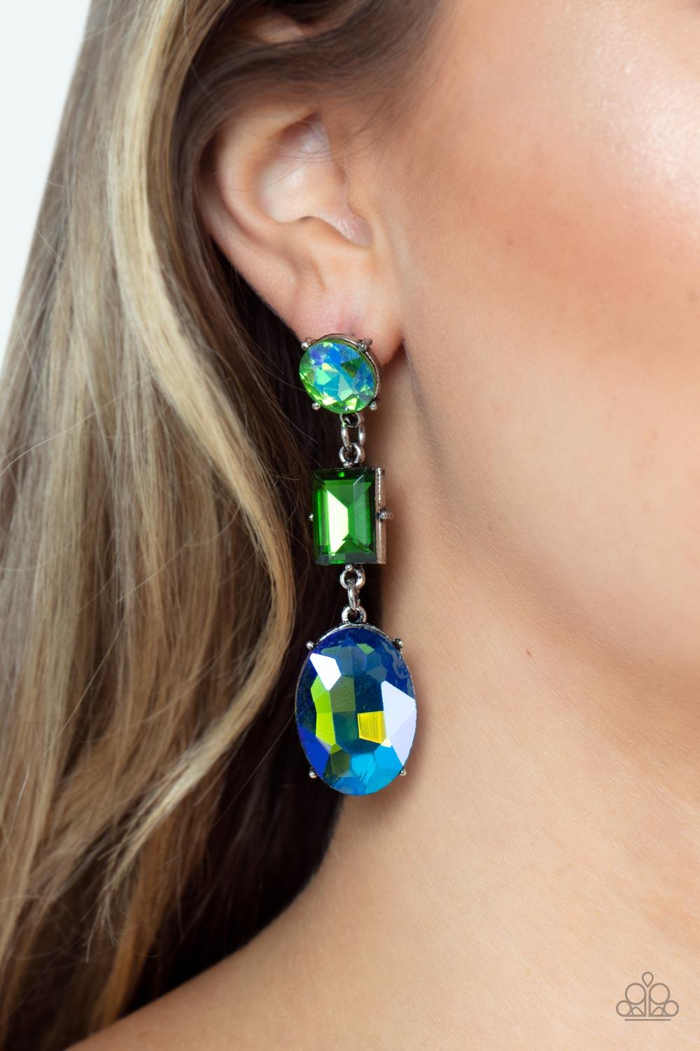 Paparazzi Accessories Extra Envious - Green Featuring flashy UV finishes, a classic round green, emerald cut green, and blue oval gem glamorously link into a jaw-dropping lure. Earring attaches to a standard post fitting. Sold as one pair of post earrings