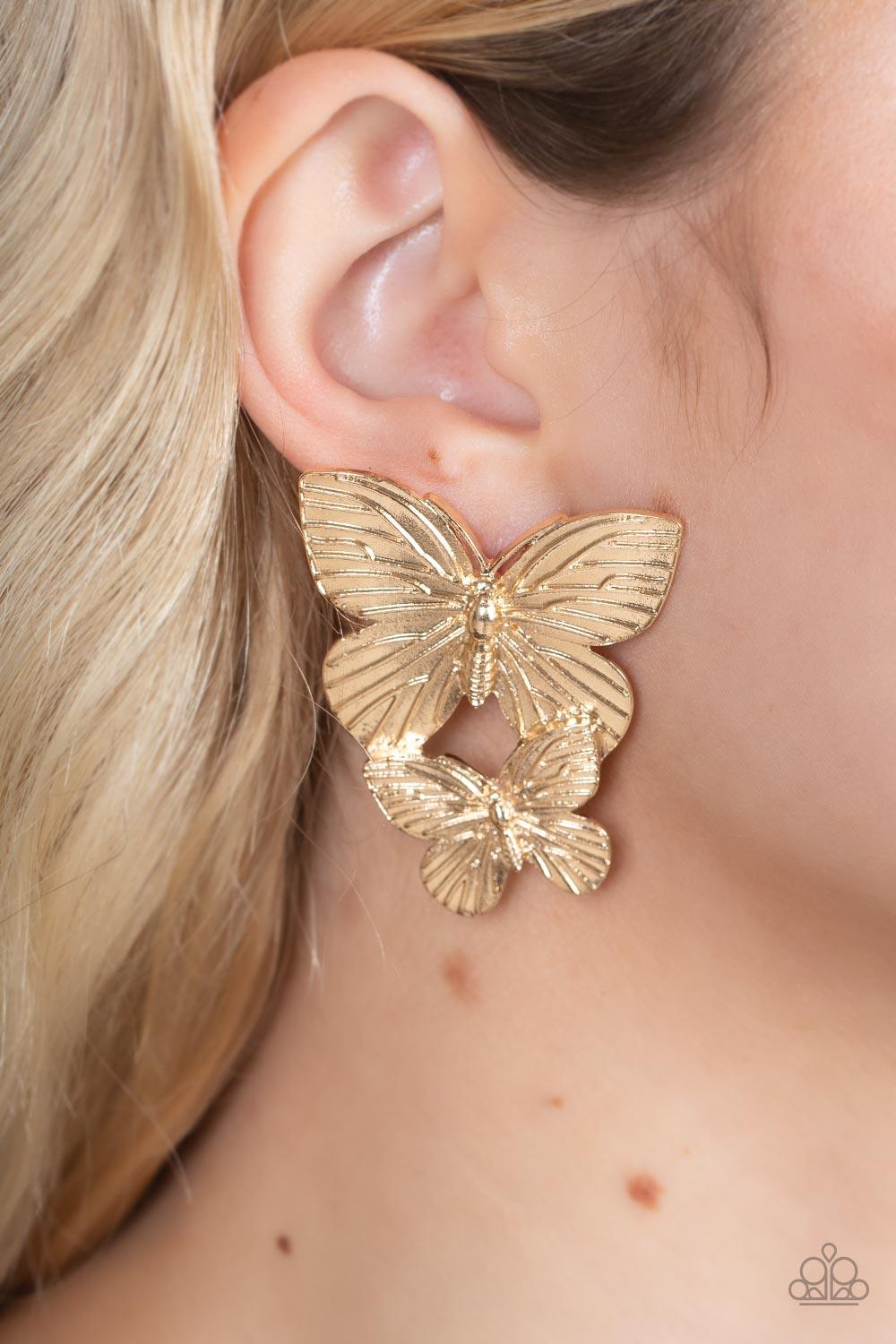 Paparazzi Accessories Blushing Butterflies - Gold Veined with lifelike textures, a pair of golden butterflies flutters from the ear for a whimsical fashion. Earring attaches to a standard post fitting. Sold as one pair of post earrings. Jewelry