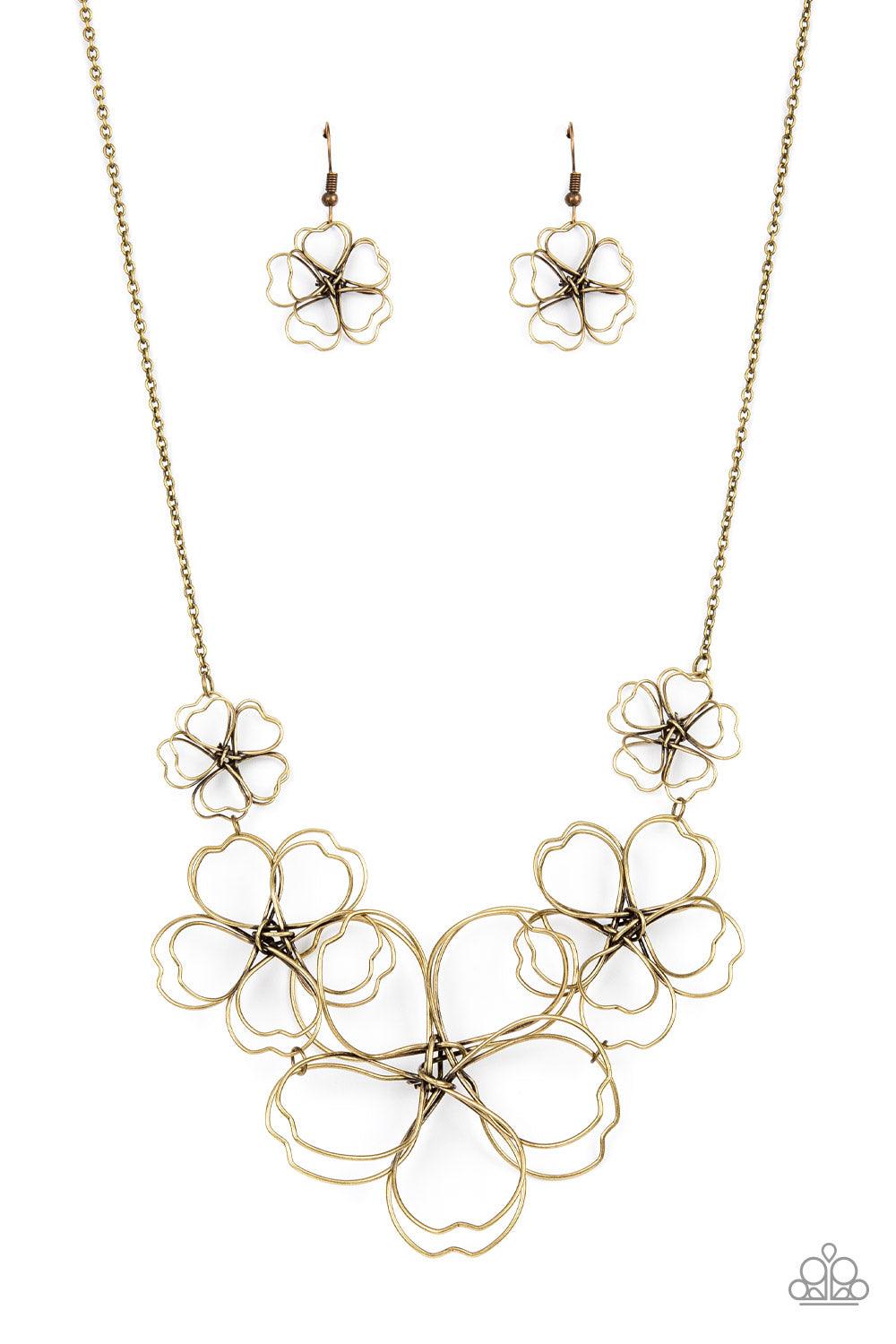 Paparazzi Accessories The Show Must GROW On - Brass Rustic brass wire delicately twists into oversized blossoms. Gradually increasing in size, the 3D frames elegantly pop beneath the collar. Features an adjustable clasp closure. Sold as one individual nec